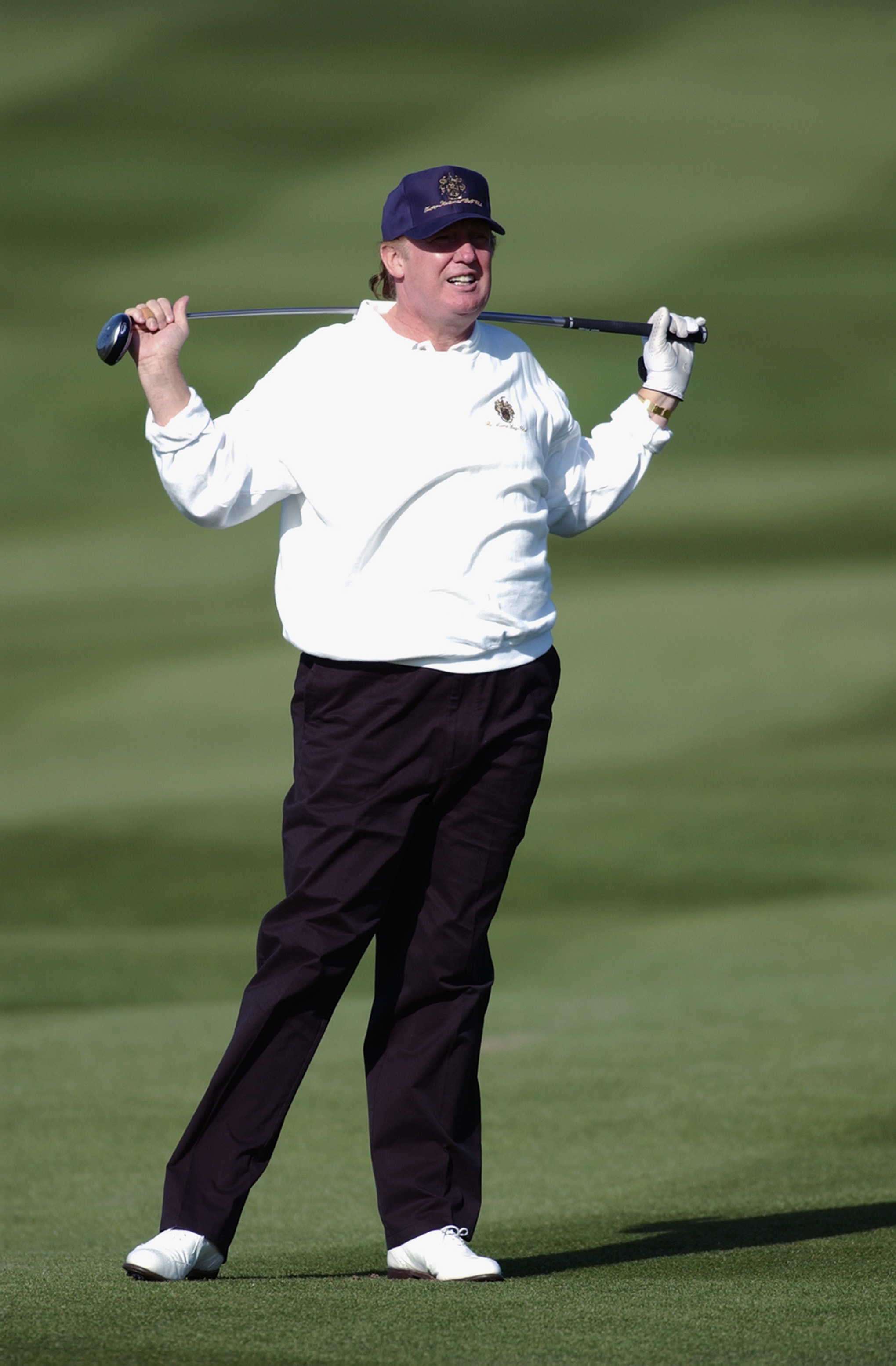 PEBBLE BEACH, CA - FEBRUARY 7:  Tycoon Donald Trump hits out of the second fairway during the second round of the AT&T Pebble Beach National Pro-Am on February 7, 2003 at Pebble Beach Golf Links in Pebble Beach, California.  (Photo by Matthew Stockman/Getty Images)