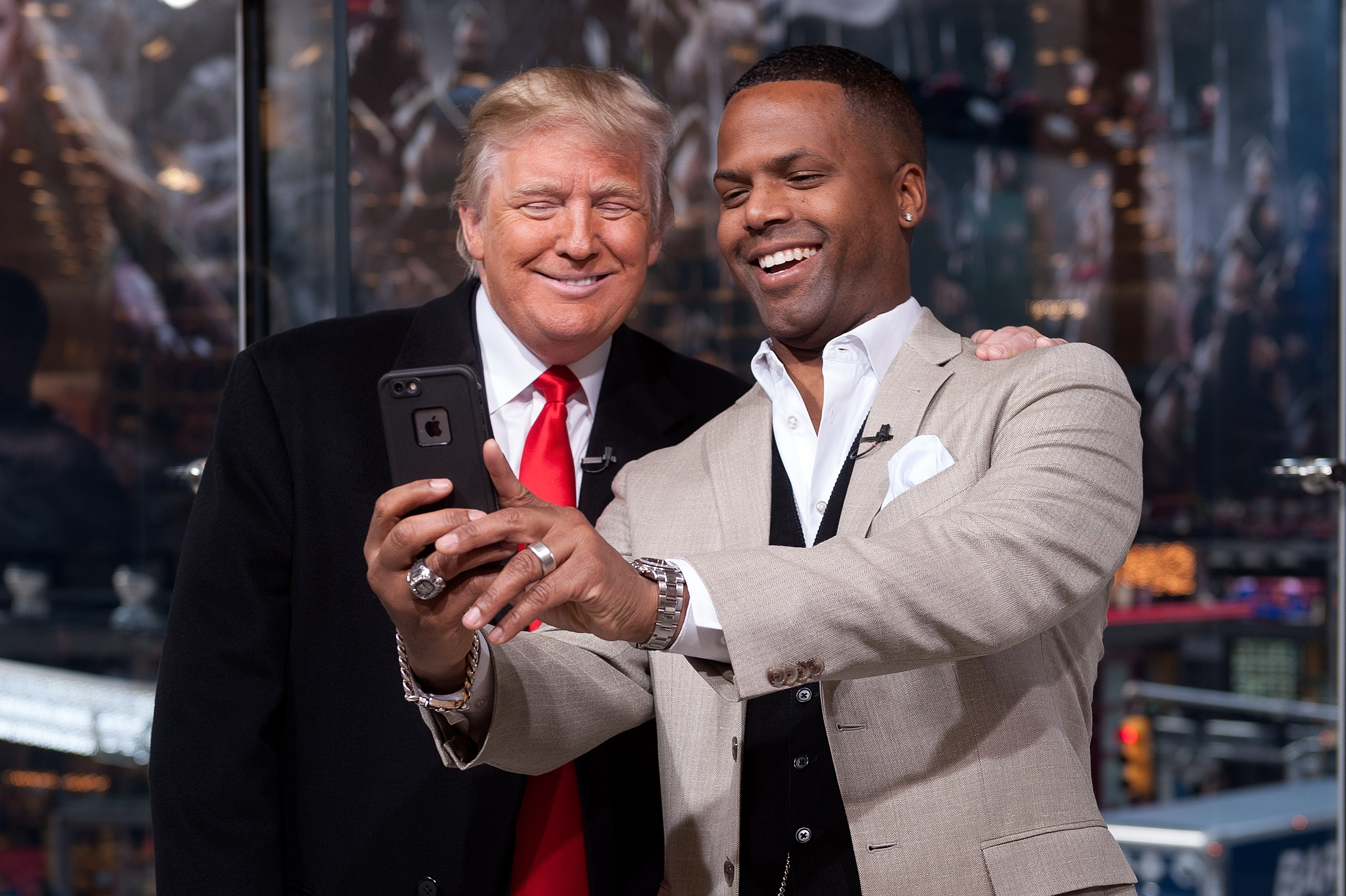 NEW YORK, NY - DECEMBER 17:  AJ Calloway (R) interviews Donald Trump during his visit to 'Extra' at their New York studios at H&M in Times Square on December 17, 2014 in New York City.  (Photo by D Dipasupil/Getty Images for Extra)